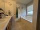 Full bathroom featuring a double vanity, decorative paint, and a large bathtub at 9704 Gull Lake Dr, Indianapolis, IN 46239