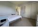 This is a cozy bedroom that features neutral paint and a double door closet for storage at 9704 Gull Lake Dr, Indianapolis, IN 46239