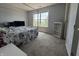 A bright bedroom with a large window, letting in plenty of natural light. The room is spacious and inviting at 9704 Gull Lake Dr, Indianapolis, IN 46239