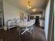 A dining room showcasing a round table and chairs, with a view into the kitchen at 9704 Gull Lake Dr, Indianapolis, IN 46239