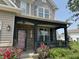 Charming front porch with decorative columns, stone accents, and a welcoming entryway at 9704 Gull Lake Dr, Indianapolis, IN 46239