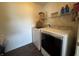Laundry room with a washer and dryer, and shelving for storage at 9704 Gull Lake Dr, Indianapolis, IN 46239