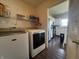 Laundry room with a view into the kitchen at 9704 Gull Lake Dr, Indianapolis, IN 46239