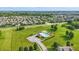 Scenic aerial view of community swimming pool area and surrounding neighborhood on a lush green landscape at 9716 Cimmaron Ave, McCordsville, IN 46055