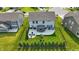 Overhead view of a large yard with green grass, landscaping, fencing, patio, gazebo and outdoor seating area at 9716 Cimmaron Ave, McCordsville, IN 46055