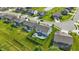 Aerial view showcasing a well-planned community with manicured lawns and a home with outdoor living spaces at 9716 Cimmaron Ave, McCordsville, IN 46055