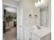 Modern bathroom featuring a vanity with sink and views into the bedroom at 9716 Cimmaron Ave, McCordsville, IN 46055