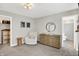 Neutral bedroom featuring a chair, dresser, and closet access at 9716 Cimmaron Ave, McCordsville, IN 46055