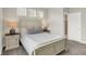 Bright bedroom features a queen-size bed with decorative pillows and bedside tables with lamps for ambient lighting at 9716 Cimmaron Ave, McCordsville, IN 46055