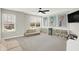 Bonus room featuring a seating area, natural light, and custom shelving at 9716 Cimmaron Ave, McCordsville, IN 46055