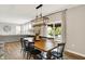 Stylish dining room featuring hardwood floors, modern light fixtures, and seamless transition to the living area at 9716 Cimmaron Ave, McCordsville, IN 46055