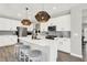Modern kitchen with stainless steel appliances, white cabinets, and center island with seating at 9716 Cimmaron Ave, McCordsville, IN 46055