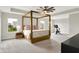 Spacious main bedroom with four-poster bed, ceiling fan, and large windows at 9716 Cimmaron Ave, McCordsville, IN 46055