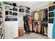 Spacious walk-in closet with custom shelving, drawers, and ample hanging space at 9716 Cimmaron Ave, McCordsville, IN 46055