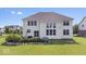 Lush backyard featuring well-manicured lawn and landscaping at 10054 Win Star Way, Fishers, IN 46040