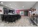 Finished basement featuring a stylish bar with seating, brick wall and a dart board at 10054 Win Star Way, Fishers, IN 46040