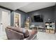 Cozy finished basement with comfortable seating, tv and game consoles at 10054 Win Star Way, Fishers, IN 46040