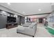 This finished basement features a stylish entertainment area, a bar, and a recreation zone at 10054 Win Star Way, Fishers, IN 46040
