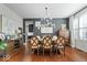 Dining room featuring a modern chandelier, hardwood floors, and ample space for entertaining at 10054 Win Star Way, Fishers, IN 46040