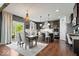 Spacious eat-in kitchen featuring hardwood floors, granite countertops, and stainless steel appliances at 10054 Win Star Way, Fishers, IN 46040