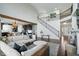 Expansive open-concept living area with hardwood floors, fireplace, staircase, and seamlessly integrated kitchen at 10054 Win Star Way, Fishers, IN 46040