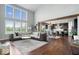 Bright, open-concept living space with large windows, soaring ceilings, and hardwood floors at 10054 Win Star Way, Fishers, IN 46040