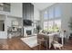 Elegant living room with fireplace, large windows, high ceilings, and stylish decor at 10054 Win Star Way, Fishers, IN 46040