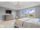 Bright main bedroom featuring ample natural light, tray ceilings, and generous closet space at 10054 Win Star Way, Fishers, IN 46040