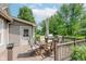 Inviting back deck features an outdoor dining set and barbecue grill, perfect for enjoying outdoor meals at 102 Roxbury Ln, Noblesville, IN 46062