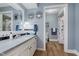 Bright bathroom featuring a large vanity, decorative mirror, and stylish decor at 102 Roxbury Ln, Noblesville, IN 46062
