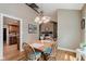 Dining room featuring a fireplace and an open view to the kitchen area at 102 Roxbury Ln, Noblesville, IN 46062