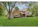 Two-story home featuring stone accents and a well-maintained lawn at 102 Roxbury Ln, Noblesville, IN 46062