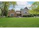 Charming home with stone accents, manicured lawn, and inviting front porch at 102 Roxbury Ln, Noblesville, IN 46062