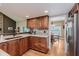 Well-designed kitchen with stainless steel sink and view of the adjacent dining area at 102 Roxbury Ln, Noblesville, IN 46062