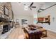 Spacious living room with vaulted ceilings, fireplace, and open layout to kitchen at 102 Roxbury Ln, Noblesville, IN 46062