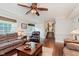 Cozy living room with a view to an adjacent staircase at 102 Roxbury Ln, Noblesville, IN 46062