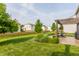 A well-manicured backyard features a pergola-covered deck and mature landscaping at 10273 Haag Rd, Brownsburg, IN 46112