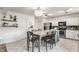 Bright kitchen boasts a large island with bar seating and modern appliances at 10273 Haag Rd, Brownsburg, IN 46112