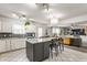 Open-concept kitchen with stainless steel appliances and a large island at 10273 Haag Rd, Brownsburg, IN 46112