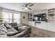 Comfortable living room featuring built-in cabinets and large windows with natural light at 10273 Haag Rd, Brownsburg, IN 46112
