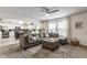 Open-concept living room and kitchen with hardwood floors and natural lighting at 10273 Haag Rd, Brownsburg, IN 46112