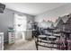 Home office featuring a desk, drum set, and mountain-themed wall art at 10273 Haag Rd, Brownsburg, IN 46112