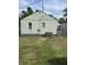 Side view of the house and backyard featuring a fenced yard at 1030 N Concord N St, Indianapolis, IN 46222