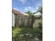 Fenced backyard, with adjacent building visible over the fence at 1030 N Concord N St, Indianapolis, IN 46222