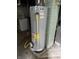 Water heater, washer, and dryer in a basement setting at 1030 N Concord N St, Indianapolis, IN 46222