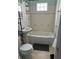 Bathroom features a pedestal sink, and a tiled shower over tub at 1030 N Concord N St, Indianapolis, IN 46222