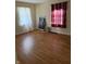 Spacious bedroom with hardwood floors and natural light at 1030 N Concord N St, Indianapolis, IN 46222