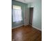 Bedroom with hardwood floors and an open closet at 1030 N Concord N St, Indianapolis, IN 46222
