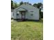 A compact single-story house with a small front yard needing some TLC at 1030 N Concord N St, Indianapolis, IN 46222