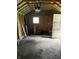 Interior of garage showing unfinished walls at 1030 N Concord N St, Indianapolis, IN 46222